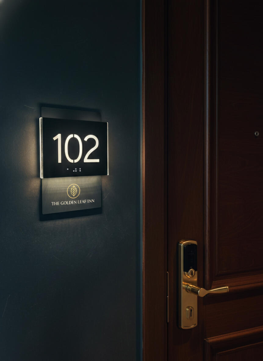 Custom hotel room plaque with illuminated numbers, ADA compliant Braille and logo